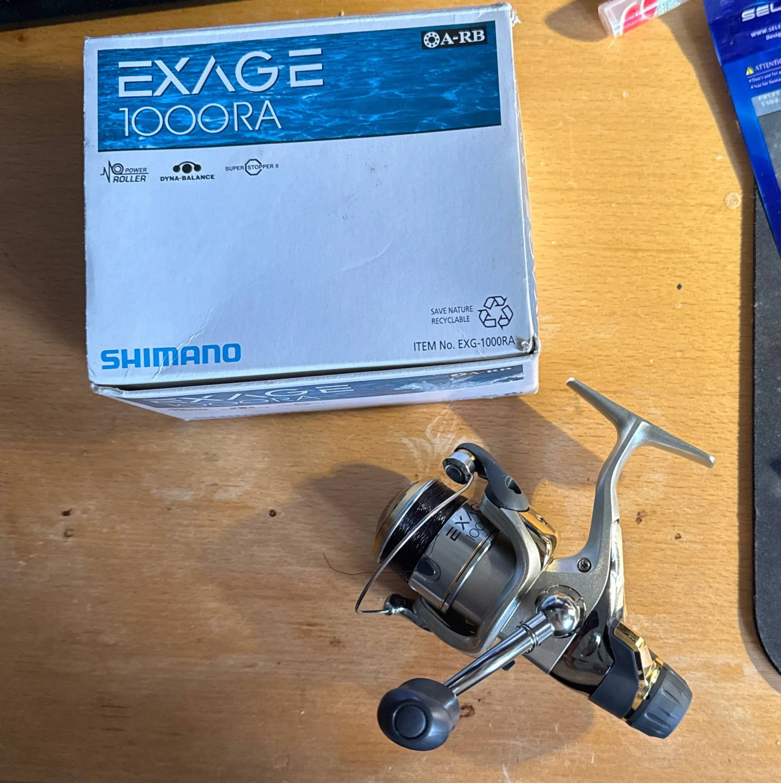 Котушка Shimano Exage 1000 RA (задній фрикціон, обслужена, зі шнуром 34 Surpass II #0.25)